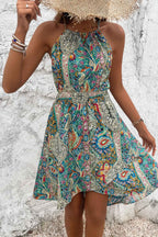 Women’s sleeveless paisley print dress featuring a flattering halter neckline, lightweight fabric, relaxed silhouette, and feminine bohemian-inspired design.