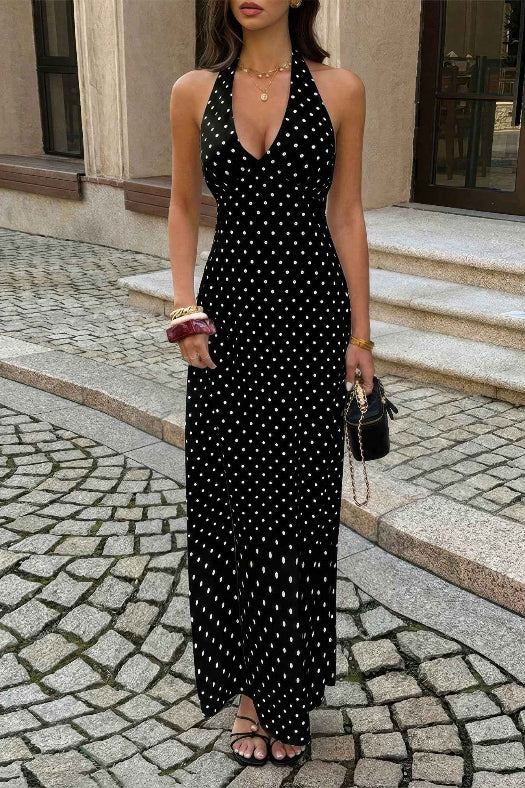Women’s polka dot halter maxi dress featuring a sleeveless neckline, fitted bodycon silhouette, timeless polka dot print, and elegant long-length design.
