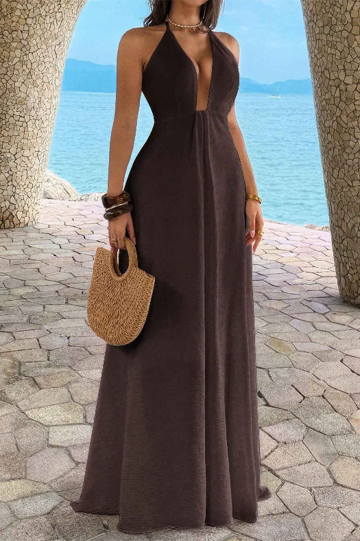 Women’s solid halter maxi dress featuring an elegant neckline, hidden back zipper, flowing A-line skirt, and sophisticated full-length silhouette.