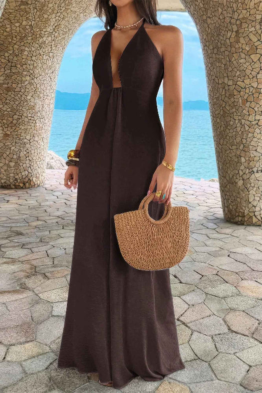 Women’s solid halter maxi dress featuring an elegant neckline, hidden back zipper, flowing A-line skirt, and sophisticated full-length silhouette.
