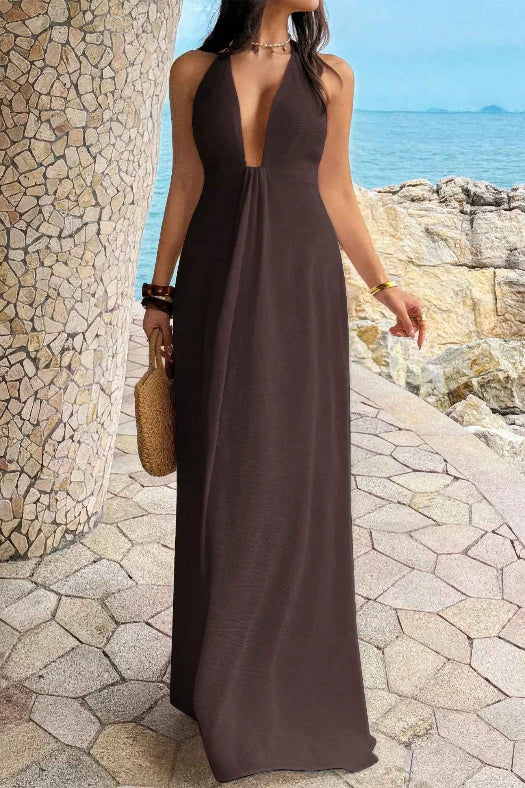 Women’s solid halter maxi dress featuring an elegant neckline, hidden back zipper, flowing A-line skirt, and sophisticated full-length silhouette.