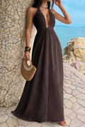Women’s solid halter maxi dress featuring an elegant neckline, hidden back zipper, flowing A-line skirt, and sophisticated full-length silhouette.