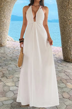 Women’s solid halter maxi dress featuring an elegant neckline, hidden back zipper, flowing A-line skirt, and sophisticated full-length silhouette.