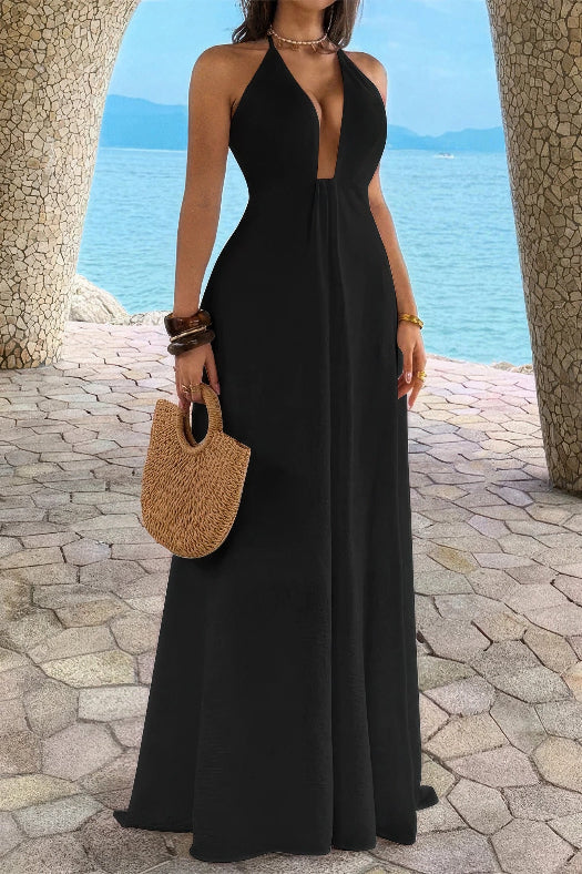 Women’s solid halter maxi dress featuring an elegant neckline, hidden back zipper, flowing A-line skirt, and sophisticated full-length silhouette in black.
