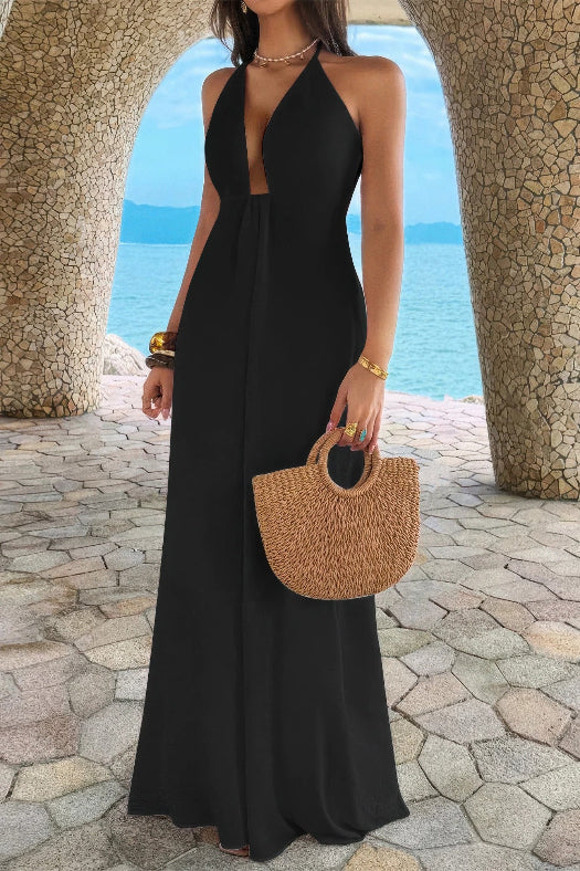 Women’s solid halter maxi dress featuring an elegant neckline, hidden back zipper, flowing A-line skirt, and sophisticated full-length silhouette in black.