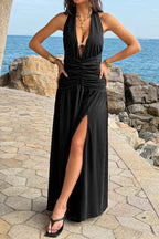 Women’s halter deep V-neck maxi dress featuring flattering ruched detailing, a dramatic high side slit, and an elegant figure-enhancing silhouette.