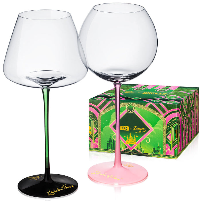 Set of two officially licensed WICKED 18-ounce stemmed wine glasses featuring Elphaba and Glinda-inspired designs.