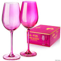 Set of two Barbie™ x Dragon Glassware® 17.5 oz stemmed wine glasses in pink and magenta with signature Barbie™ logos on the bases and coordinating pink gift box.
