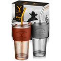 Set of two officially licensed Yellowstone 20-ounce glass drinking tumblers featuring Western-inspired designs with reusable lids and straws.