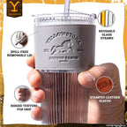 Set of two officially licensed Yellowstone 20-ounce glass drinking tumblers featuring Western-inspired designs with reusable lids and straws.