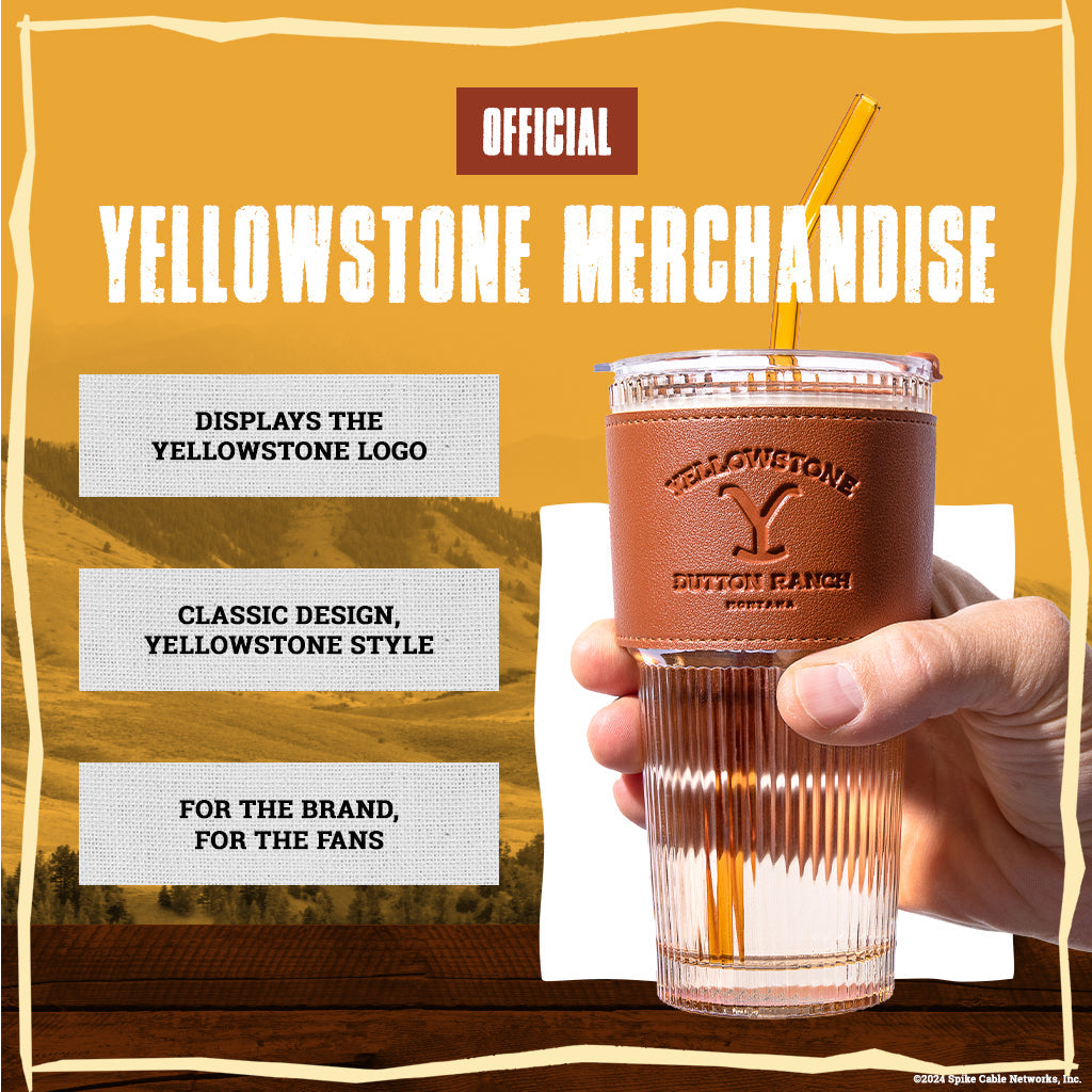 Set of two officially licensed Yellowstone 20-ounce glass drinking tumblers featuring Western-inspired designs with reusable lids and straws.