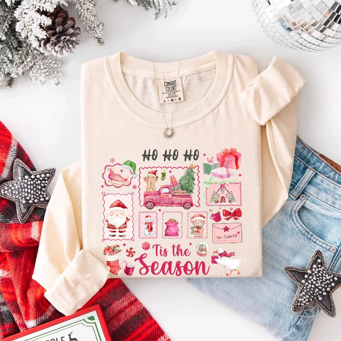 Comfort Colors Ho Ho Ho ’Tis The Season long sleeve Christmas shirt featuring a festive holiday graphic on a relaxed garment-dyed 100% cotton tee in Ivory