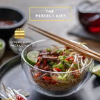 Set of two clear double wall glass cereal and soup bowls with a modern transparent design.