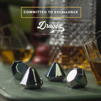 Set of four diamond-shaped stainless steel chilling stones by Dragon Glassware designed to cool whiskey and other beverages without melting or diluting drinks.
