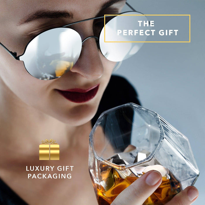 Set of four diamond-shaped stainless steel chilling stones by Dragon Glassware designed to cool whiskey and other beverages without melting or diluting drinks.