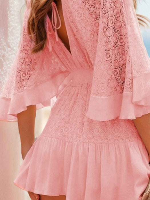 Hope Ruffle Hem Lace Mini Dress featuring delicate lace detailing, a flowy silhouette, feminine ruffle hem, and adjustable tie-back design, perfect for weddings, bridal showers, vacations, and spring or summer occasions. Color Blush pink