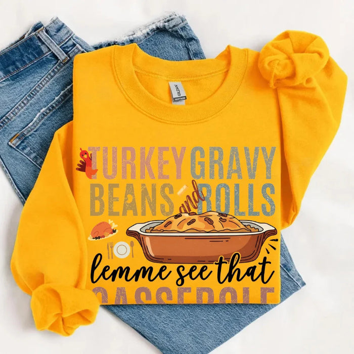 Turkey Gravy Beans & Rolls funny Thanksgiving crewneck sweatshirt featuring a holiday food-inspired graphic in a classic unisex fit in Gold