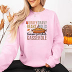 Turkey Gravy Beans & Rolls funny Thanksgiving crewneck sweatshirt featuring a holiday food-inspired graphic in a classic unisex fit in Light Pink