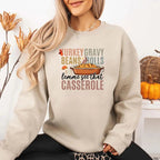 Turkey Gravy Beans & Rolls funny Thanksgiving crewneck sweatshirt featuring a holiday food-inspired graphic in a classic unisex fit in Sand