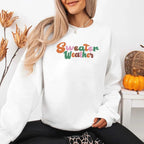 Sweater Weather Fall Vibes unisex crewneck sweatshirt featuring a cozy autumn-inspired graphic design for fall in White